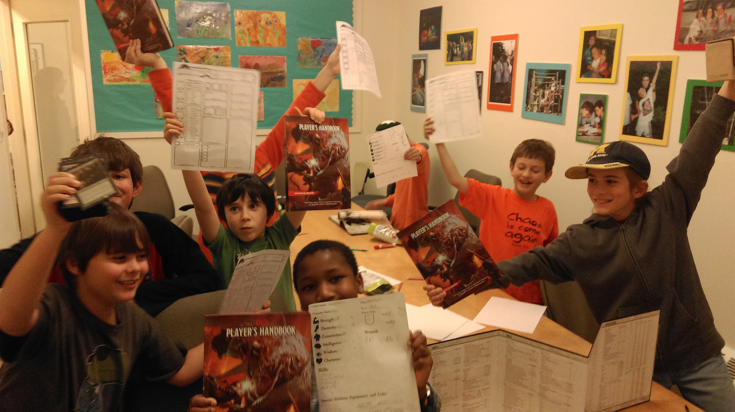 Table of enthusiastic students playing Dungeons & Dragons